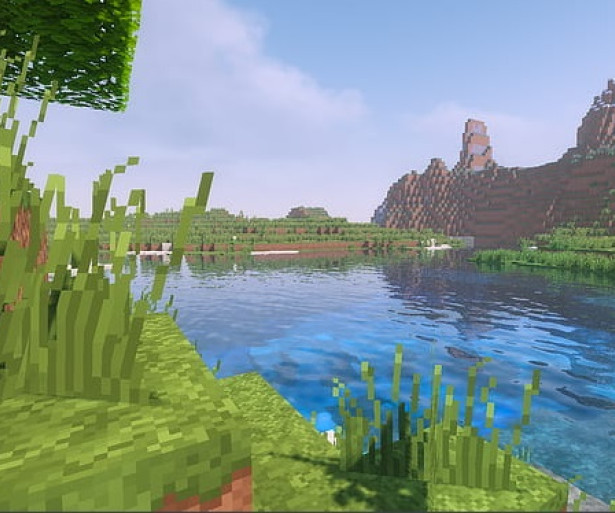 A beautiful lake under Minecrafts blue sky 